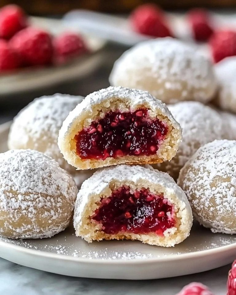 Raspberry Filled Almond Snowball Cookies